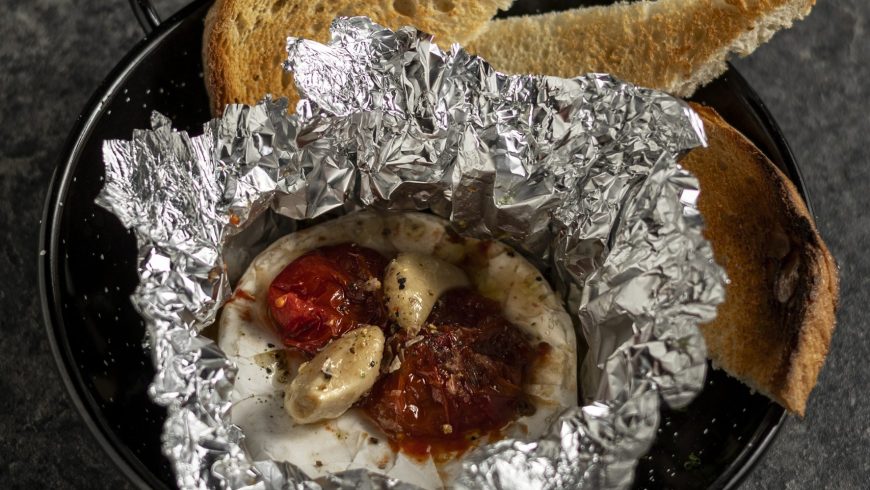 Oven baked camembert with white wine and cherry tomato confit with toast