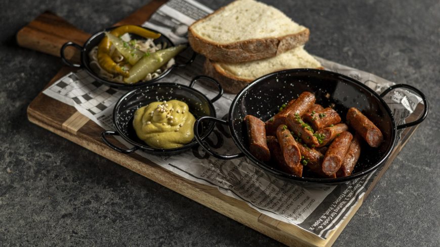 Cold classic sausage with homemade pickles and mustard