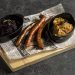 Classic baked sausage with stewed cabbage and potato mash with fried onion