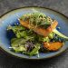 Salmon steak with mashy pea puree and butter sauce