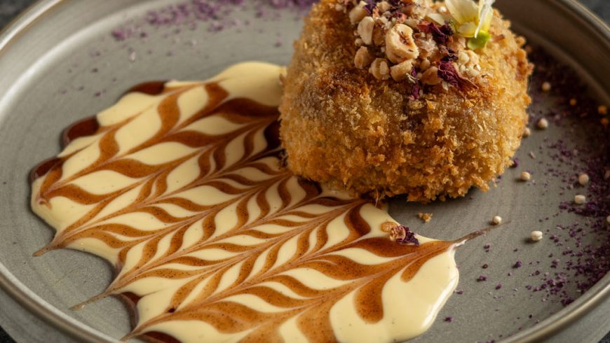 Plum cinnamon deep fried ice cream with vanilla sauce